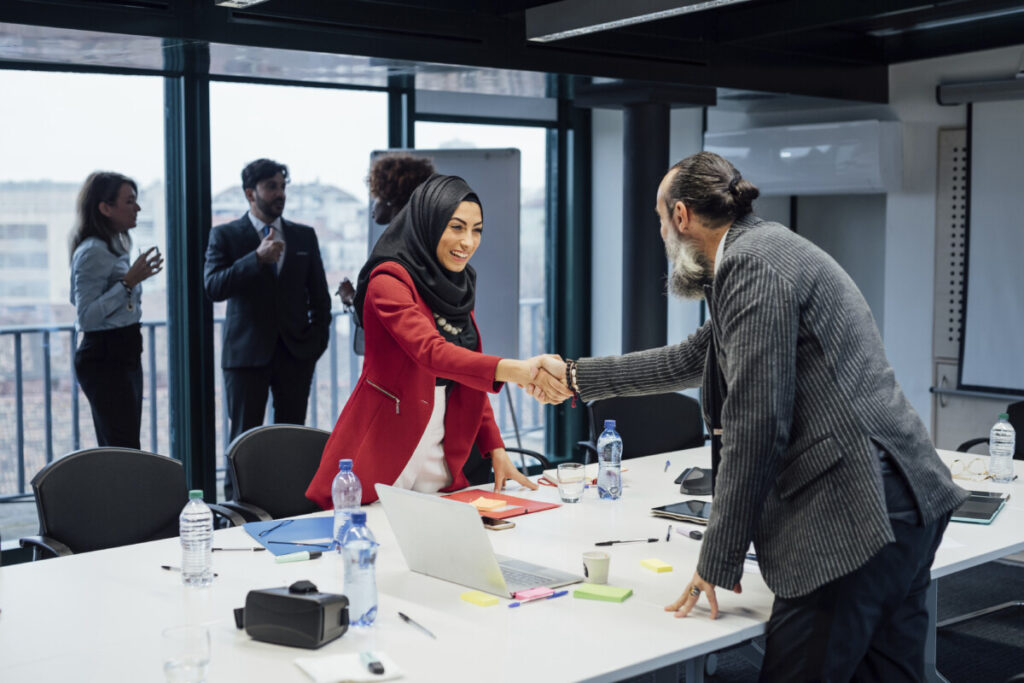 Business Meeting team shaking hands